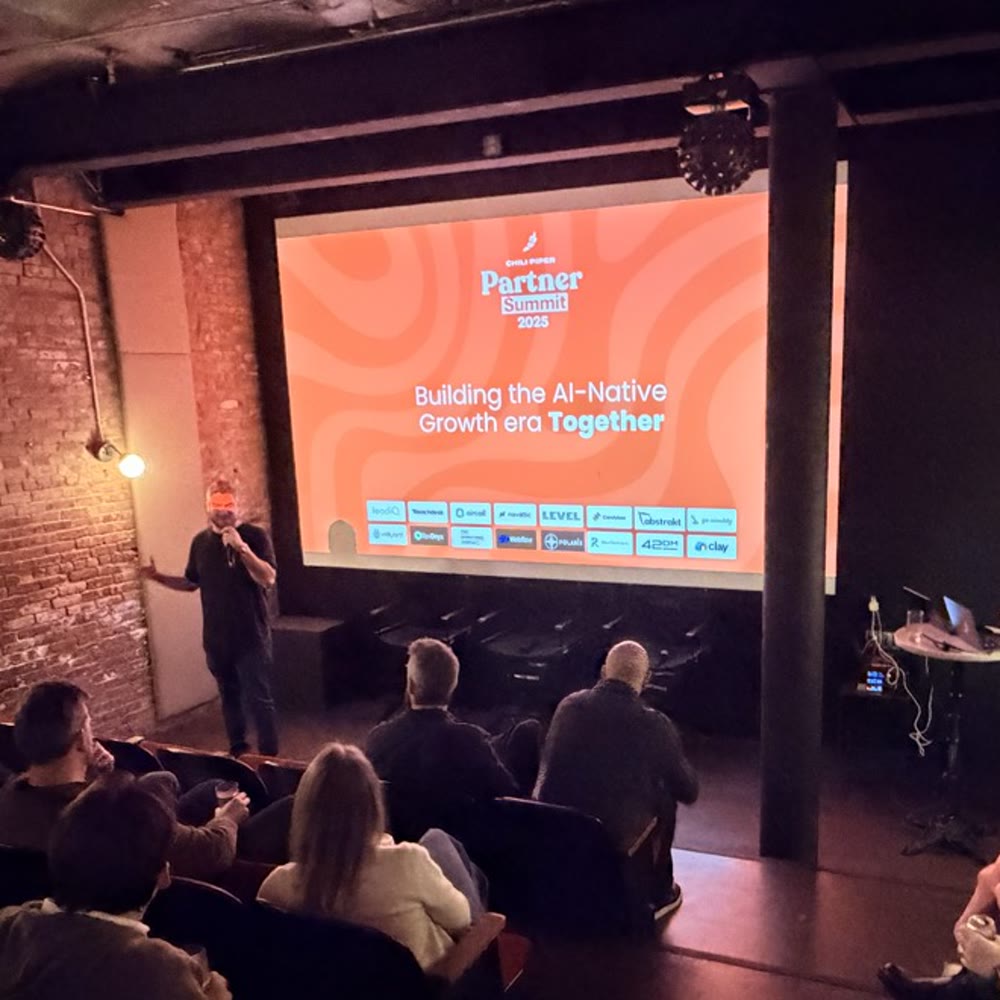 Speaker presenting the Partner Summit keynote to a full room