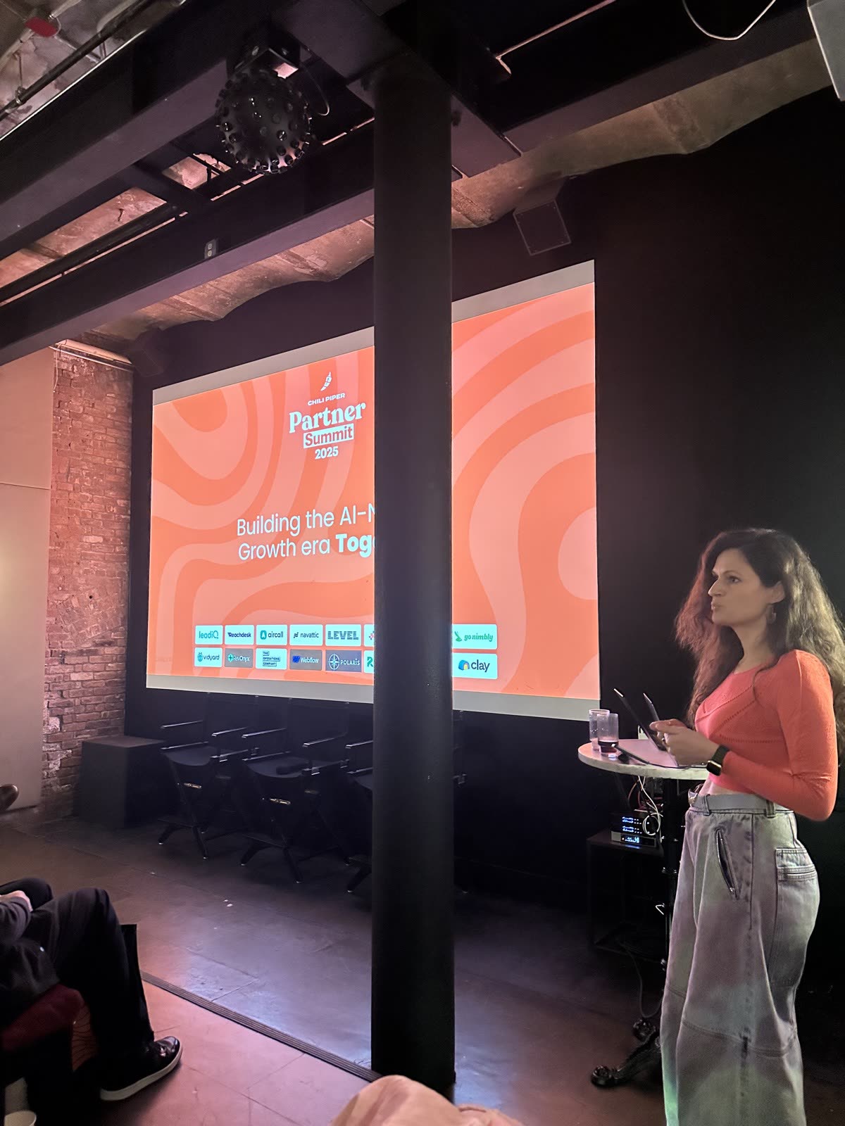 Speaker on stage at the Chili Piper Partner Summit
